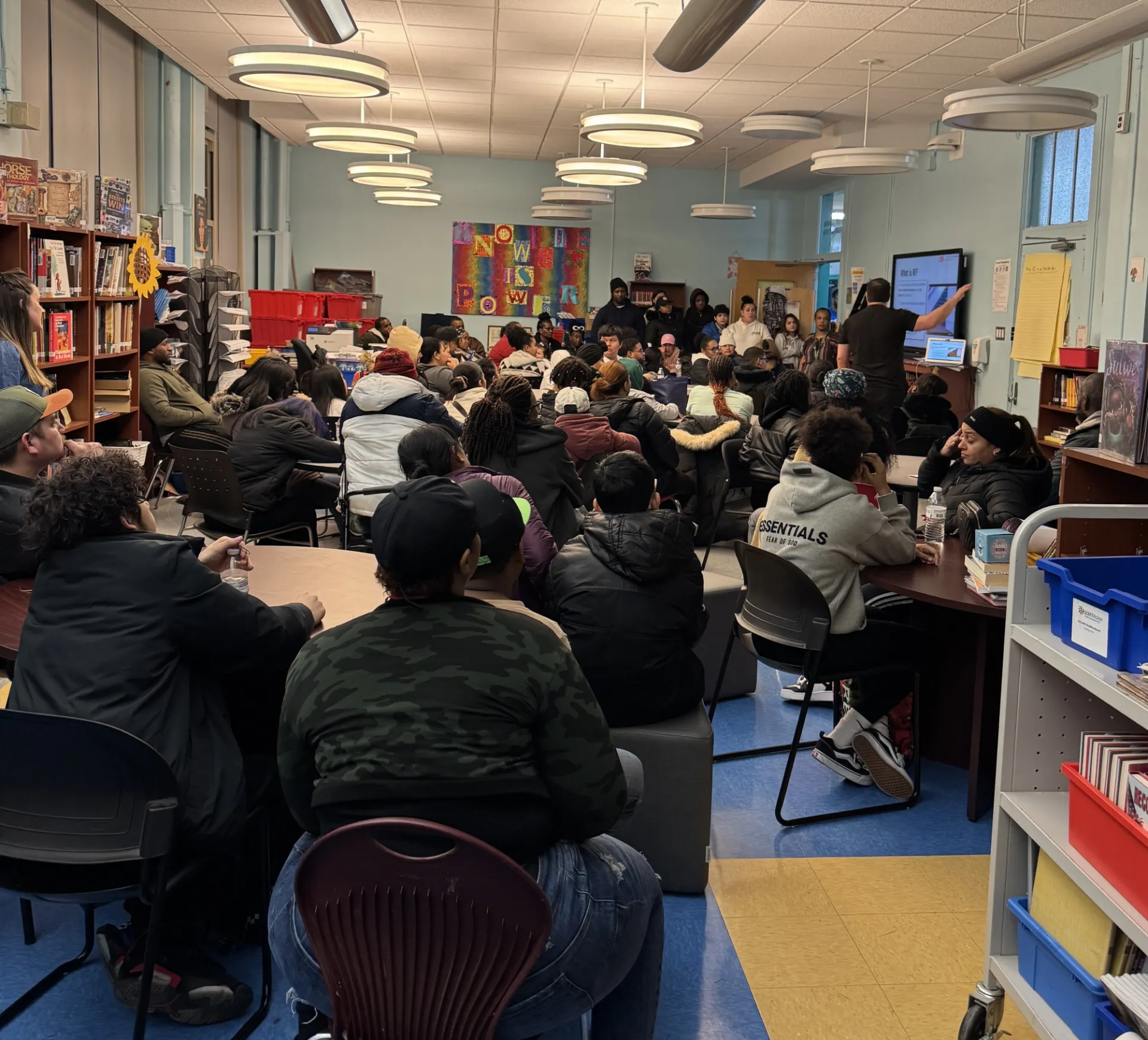 Families gather for AI night at a middle school in the Bronx. 