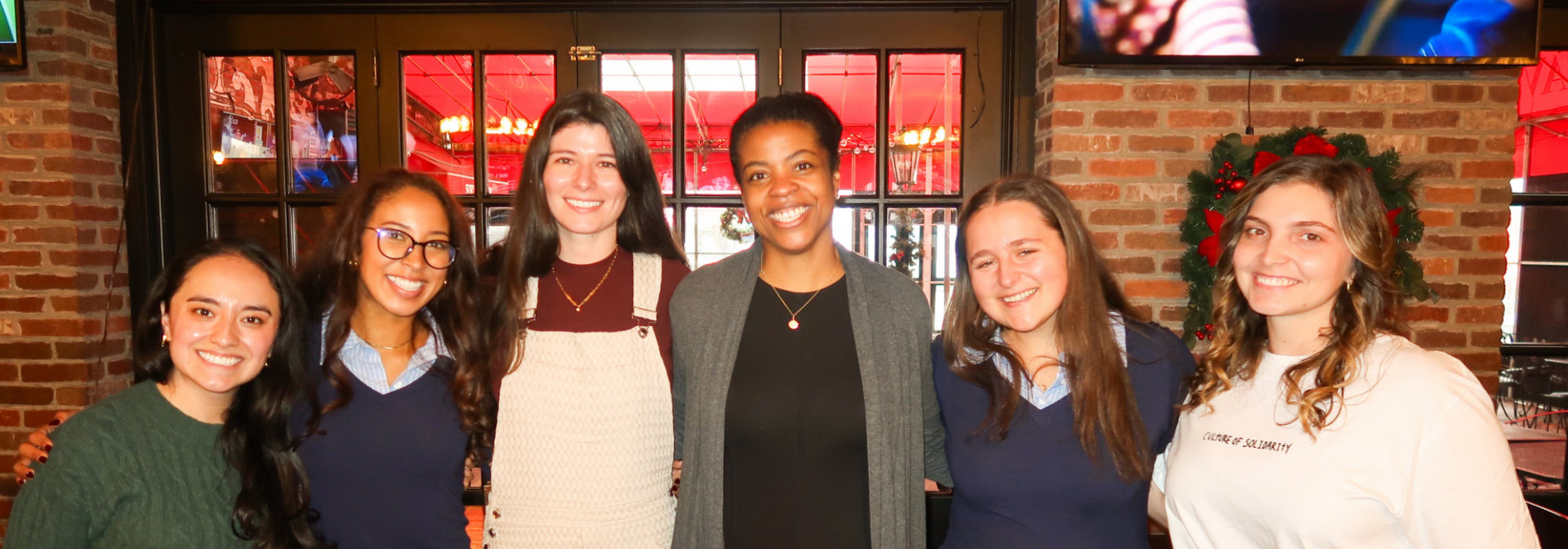 a project team standing side by side at the end of semester celebration