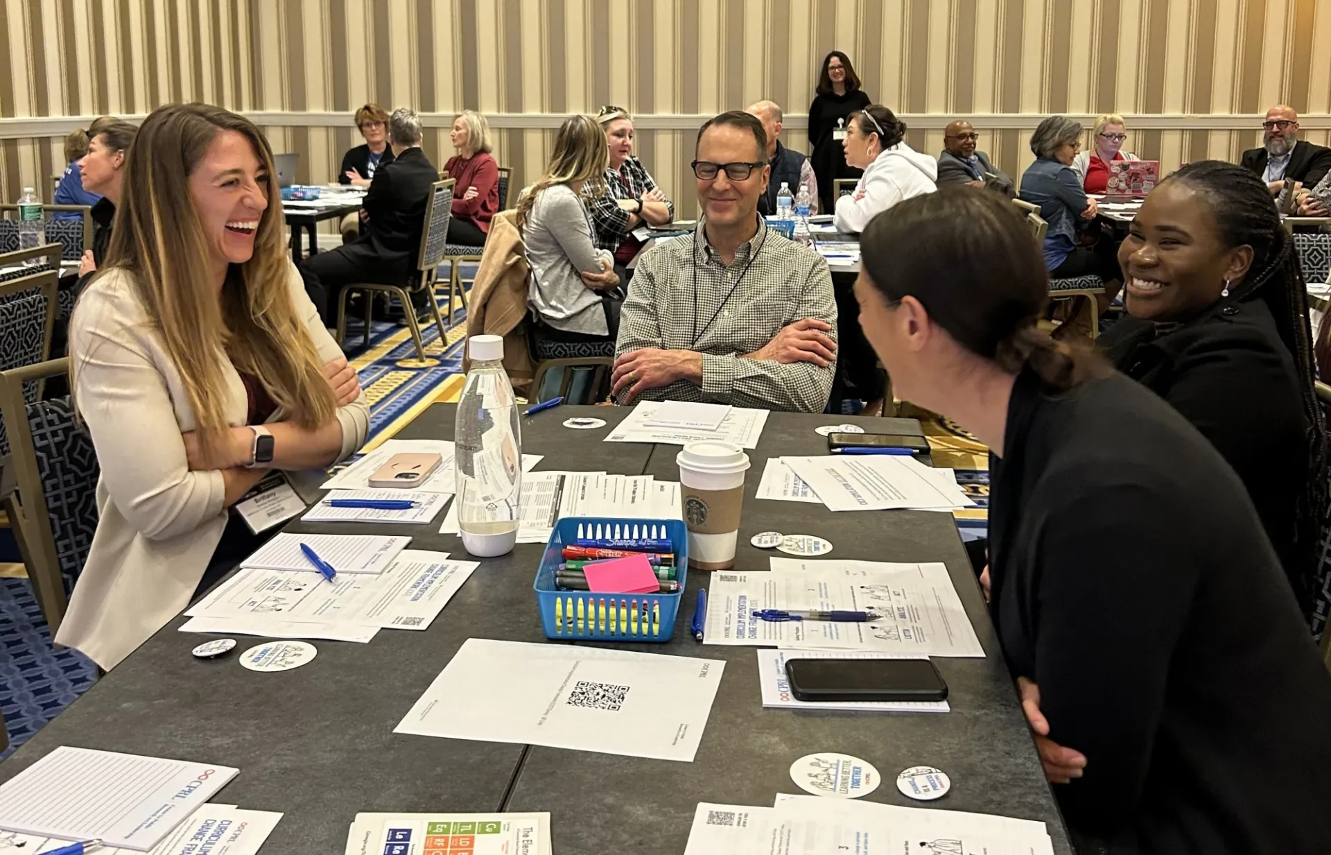 people working together at a table. 
