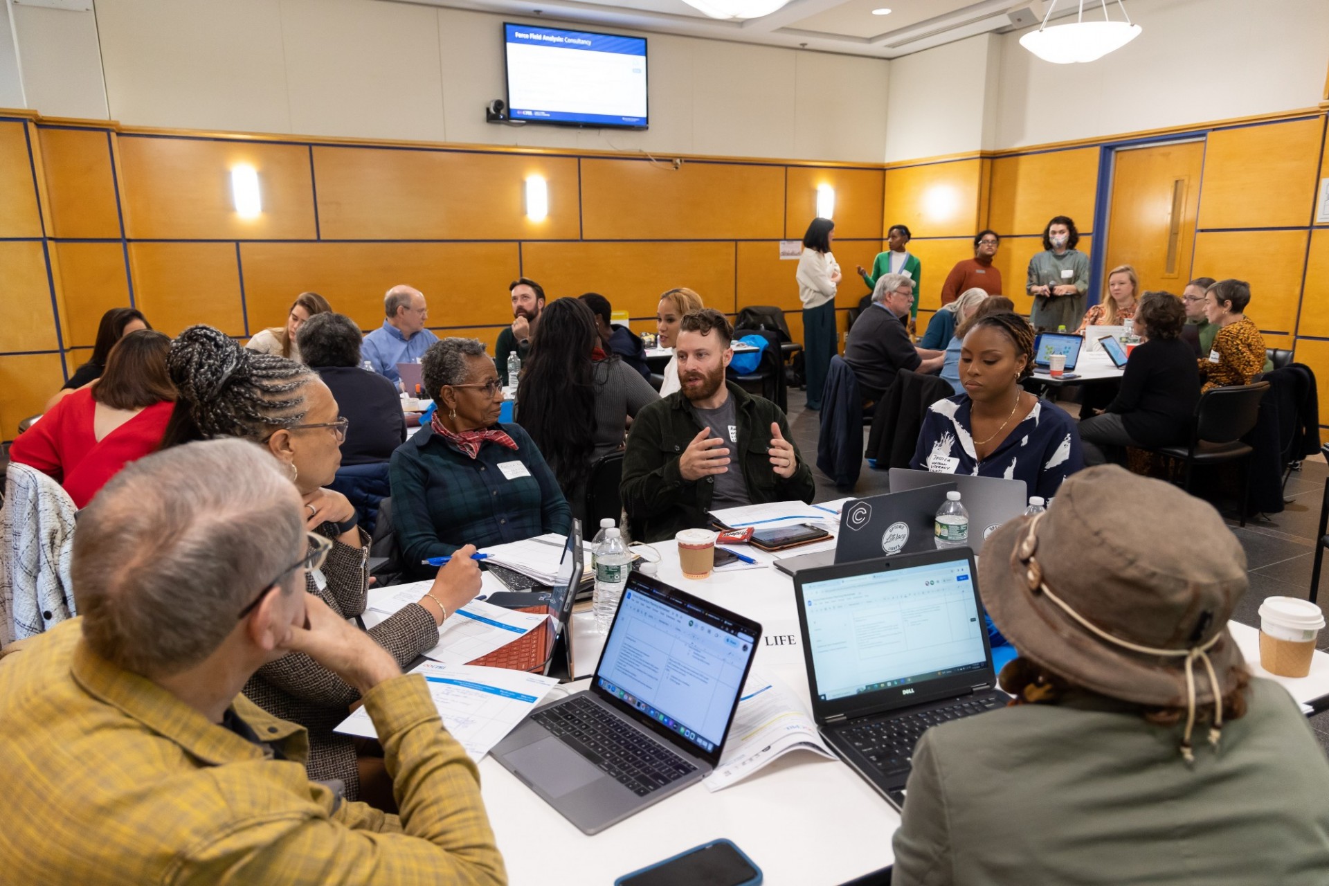 People talking in a conference room as part of a CPRL Strategy lab