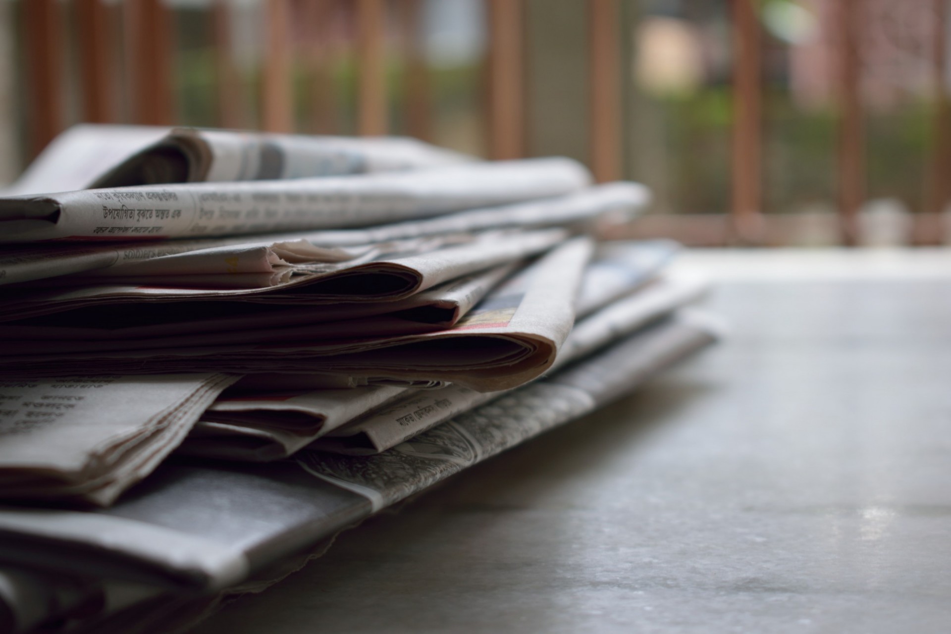 Pile of newspapers aligned to the left