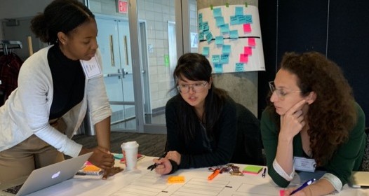 Project Director working with two students