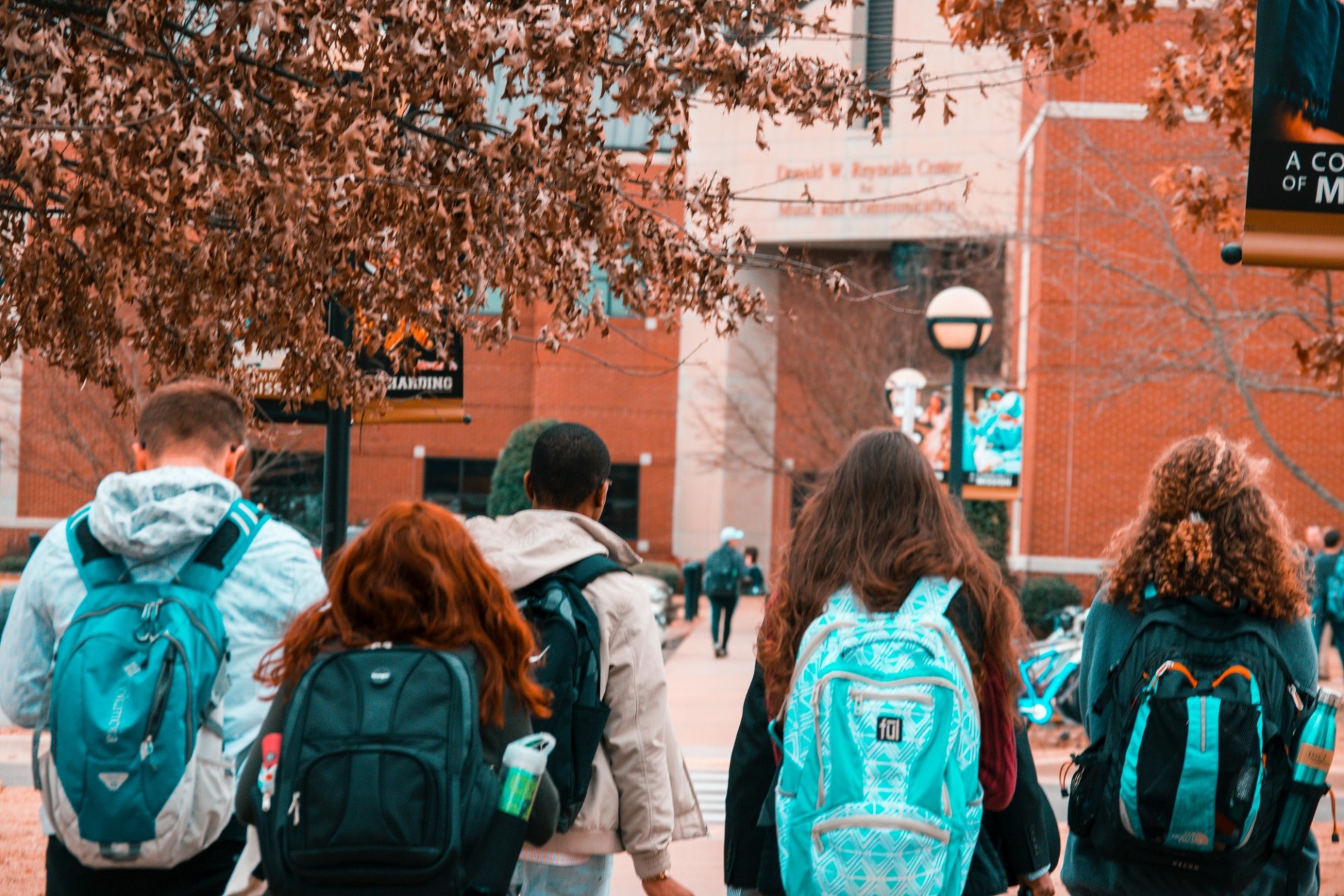 High school students walking toward school building